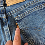 Load image into Gallery viewer, Vintage Levi's 550 Relaxed Fit Slim Orange Tab Jeans 7
