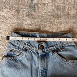 Load image into Gallery viewer, Vintage Levi's 550 Relaxed Fit Slim Orange Tab Jeans 9 USA
