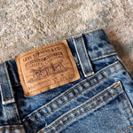 Load image into Gallery viewer, Vintage Levi's 550 Relaxed Fit Slim Fit Orange Tab Jeans 9 USA

