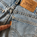 Load image into Gallery viewer, Vintage Levi's 550 Relaxed Fit Slim Orange Tab Jeans 9 USA
