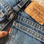 Load image into Gallery viewer, Vintage Levi's 550 Relaxed Fit Slim Fit Orange Tab Jeans 9 USA
