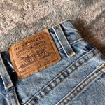 Load image into Gallery viewer, Vintage Levi's 550 Relaxed Fit Slim Orange Tab Jeans 9 USA
