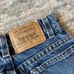 Load image into Gallery viewer, Vintage Levi's 550 Relaxed Fit Slim Orange Tab Jeans 7
